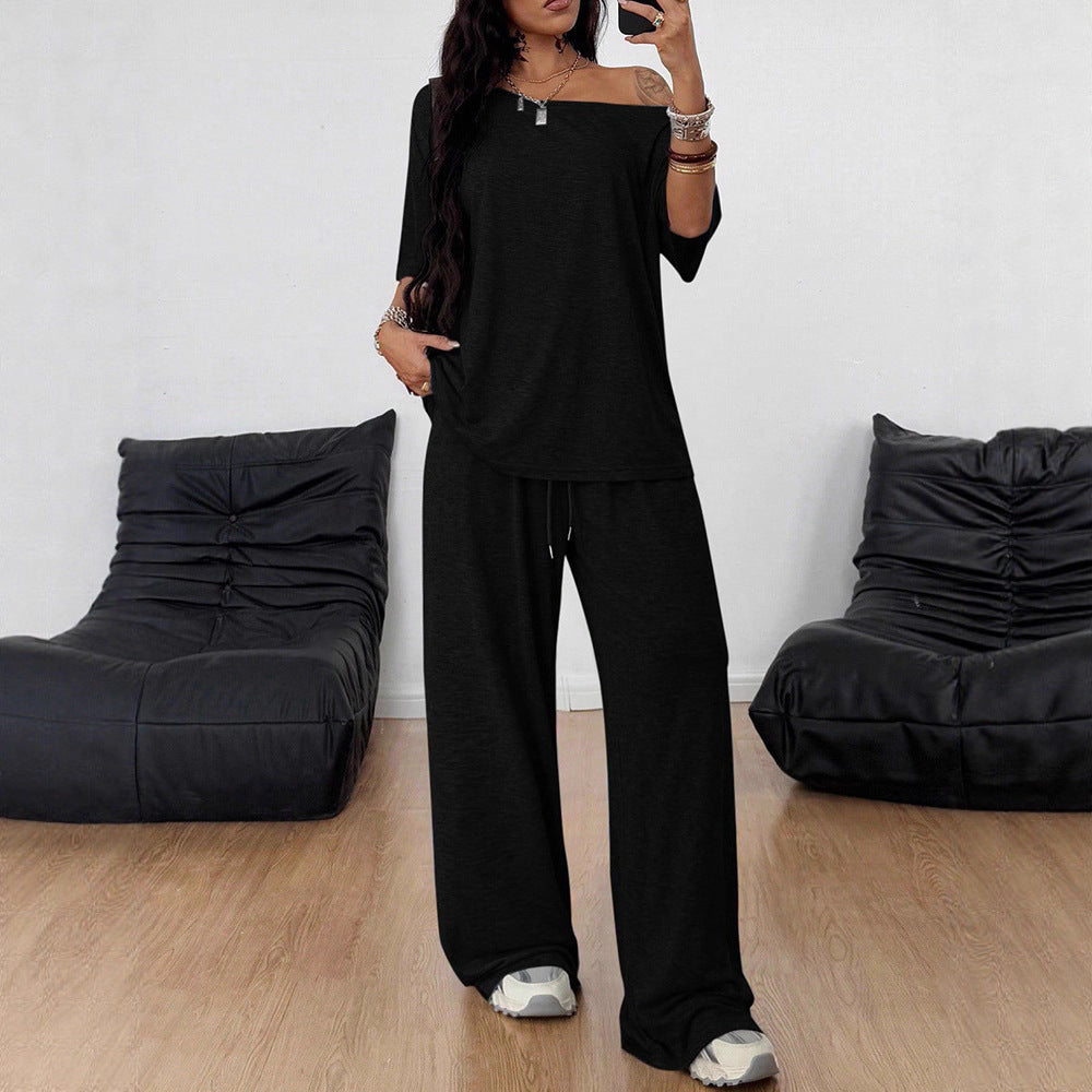 Person wearing a black outfit in a room with black bean bags.