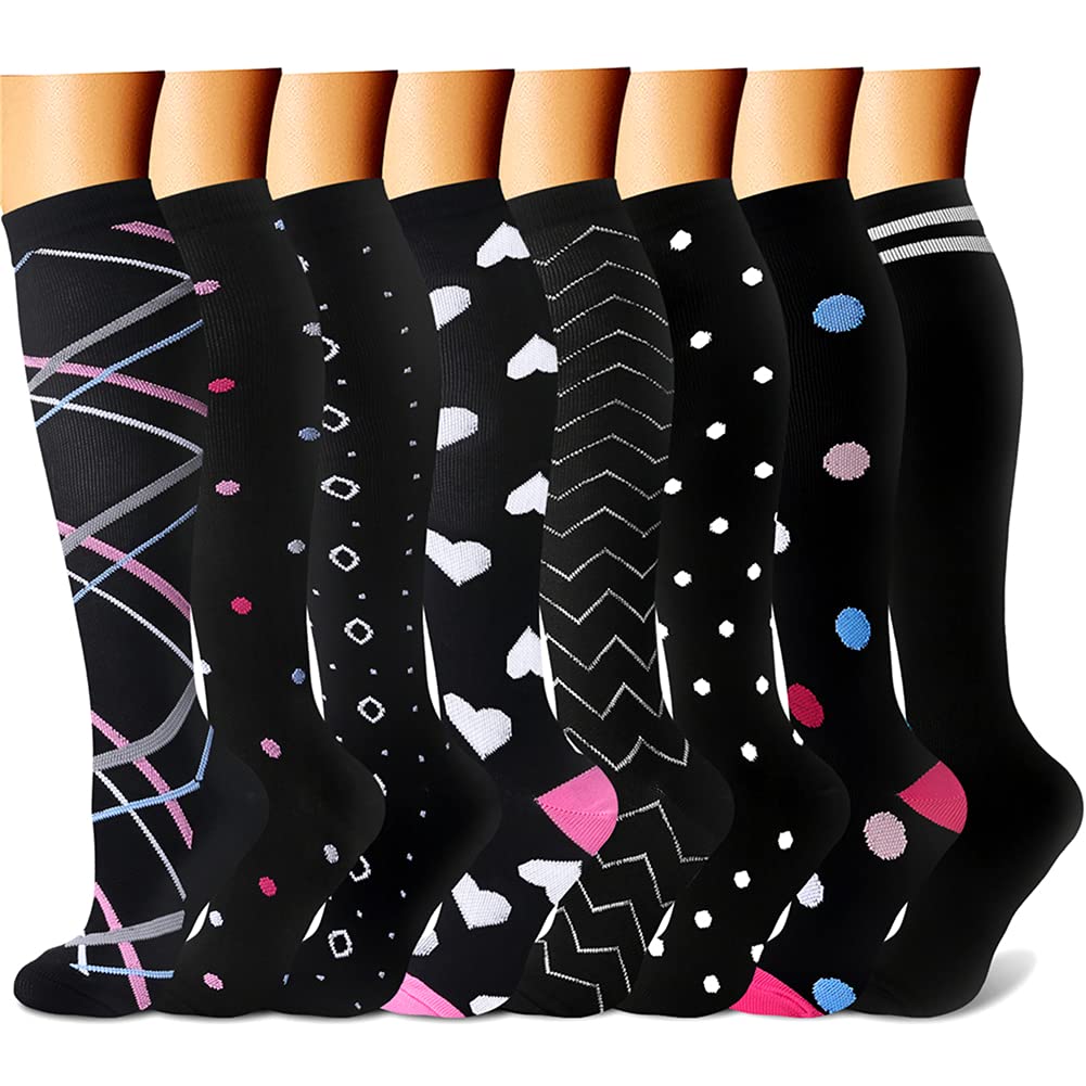 Set of black knee-high socks with various patterns on a white background
