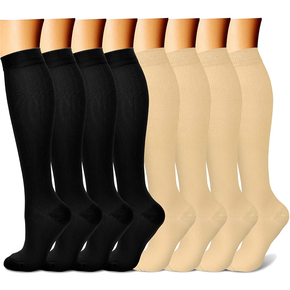 Set of black and beige knee-high socks on a white background