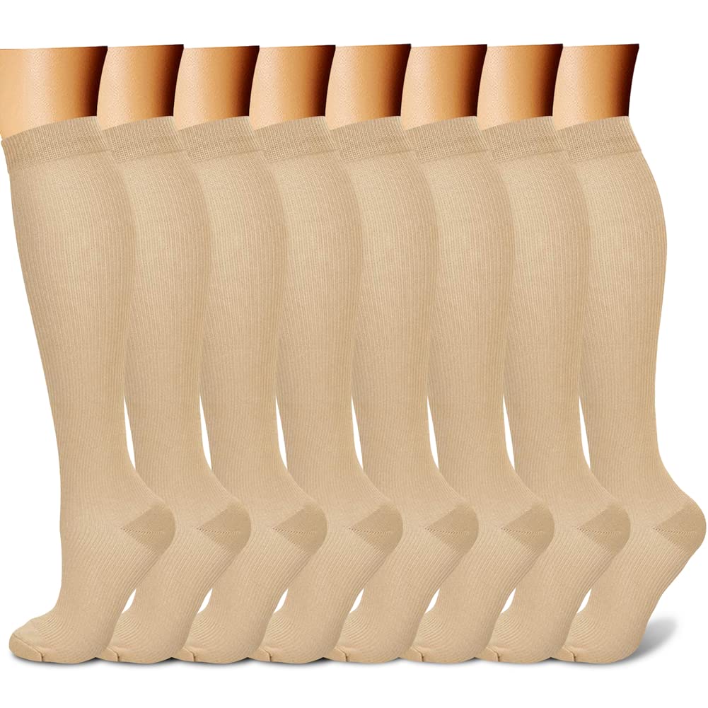Beige knee-high socks displayed on a mannequin against a white background