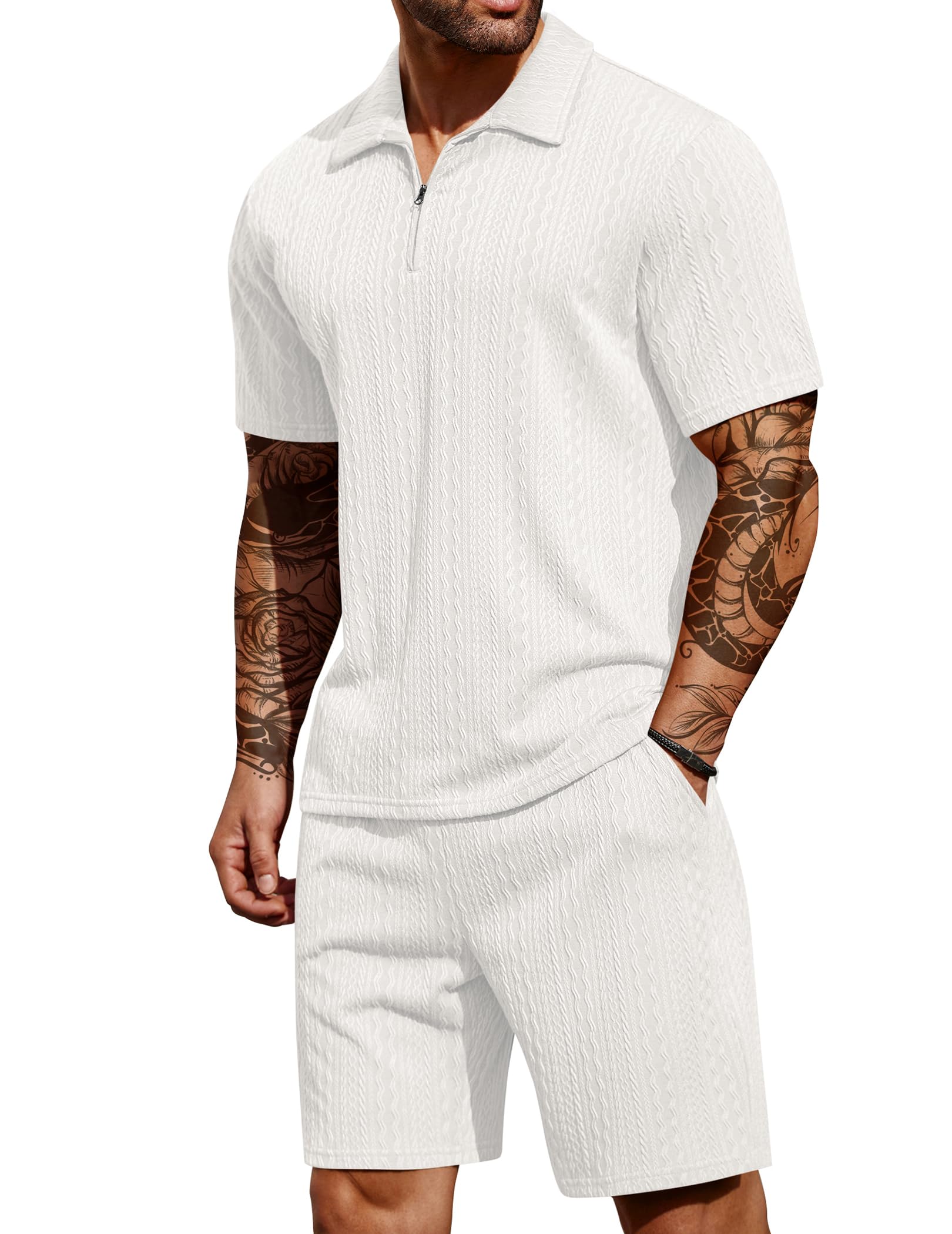 Man wearing a white ribbed polo shirt and shorts set on a white background