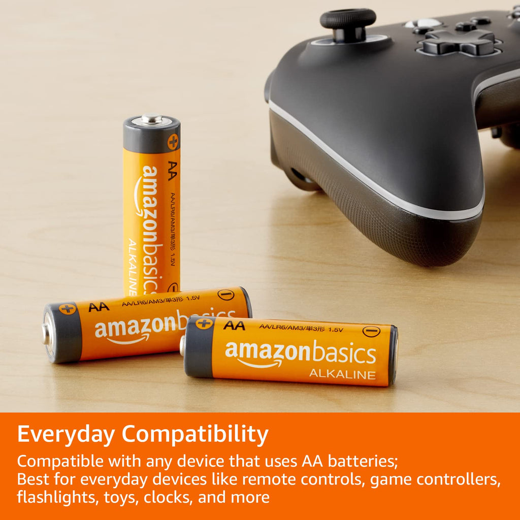 Amazon Basics batteries and a gaming controller on a wooden surface with text about compatibility.