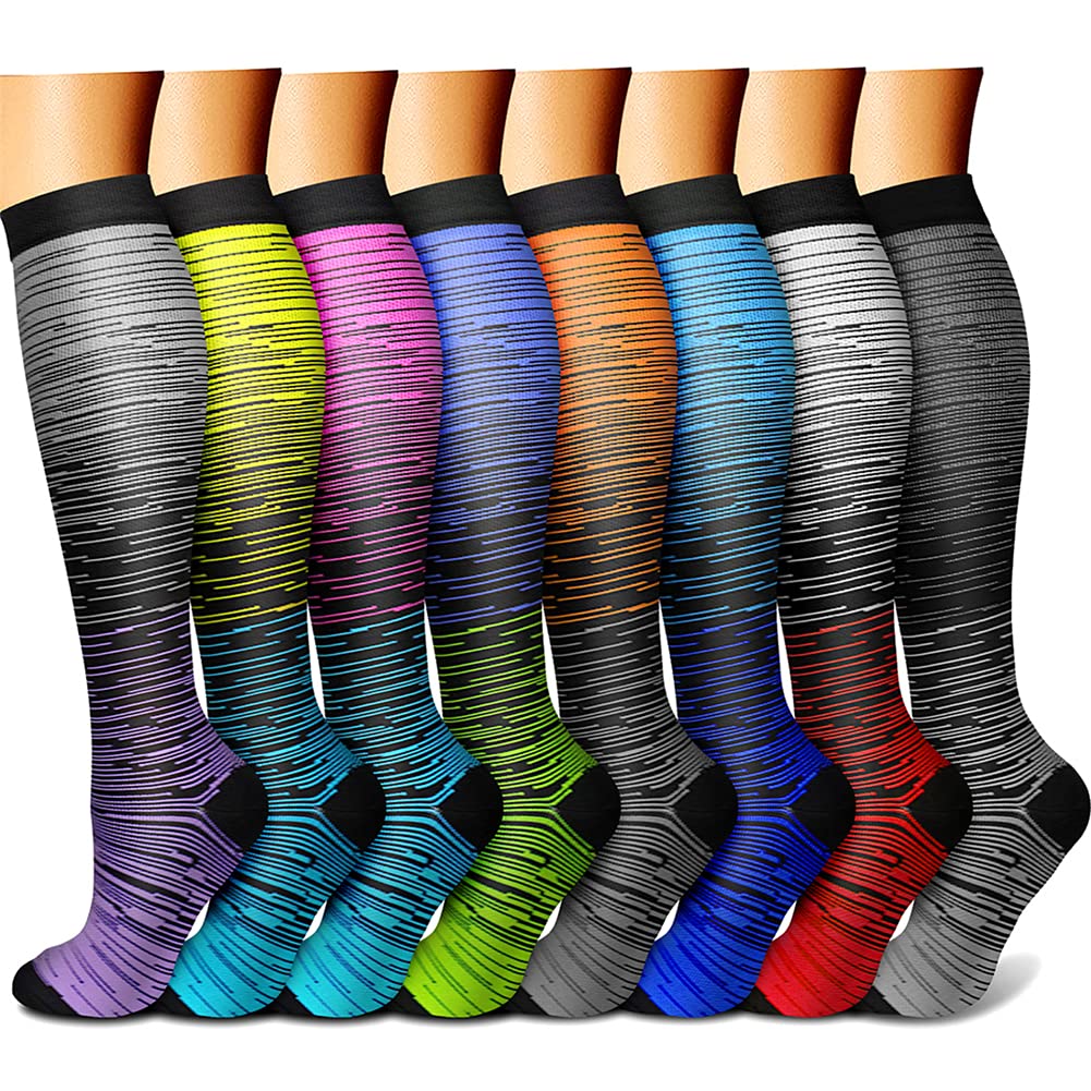 Colorful knee-high socks arranged in a row on a white background