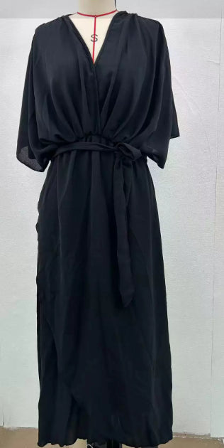 Black dress on a mannequin against a white background