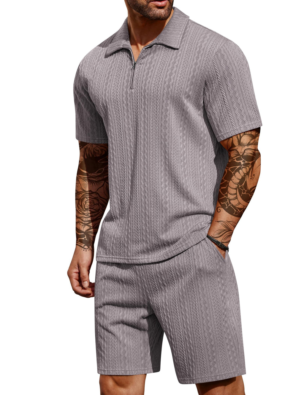 Man wearing a gray short-sleeve romper with a white background
