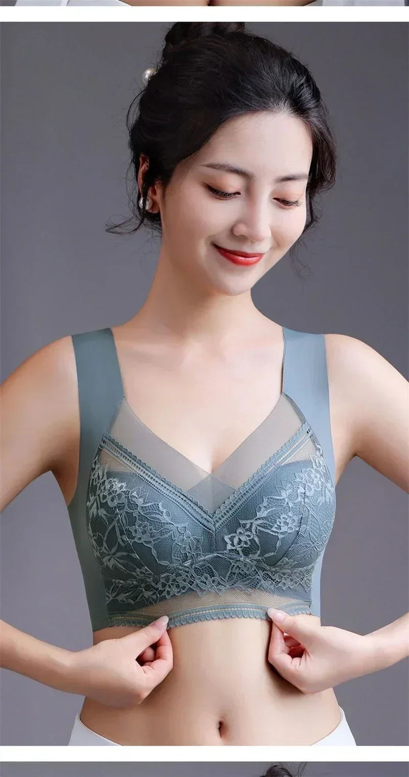 Woman wearing a gray bra with floral patterns on a gray background