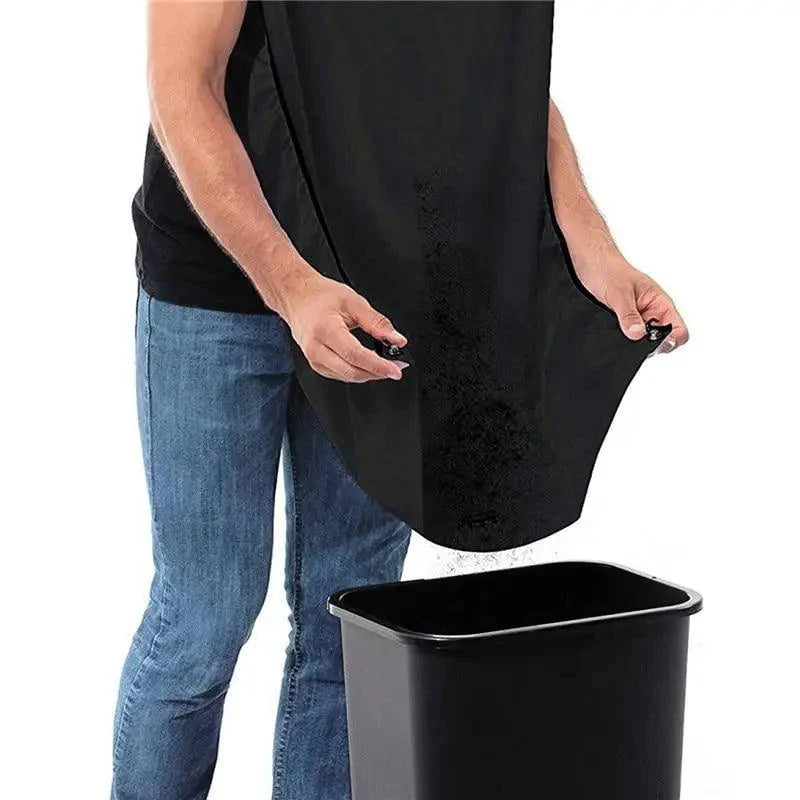Person using black cloth bathroom accessory to dispose shaved facial hair into a black trash can on a white background